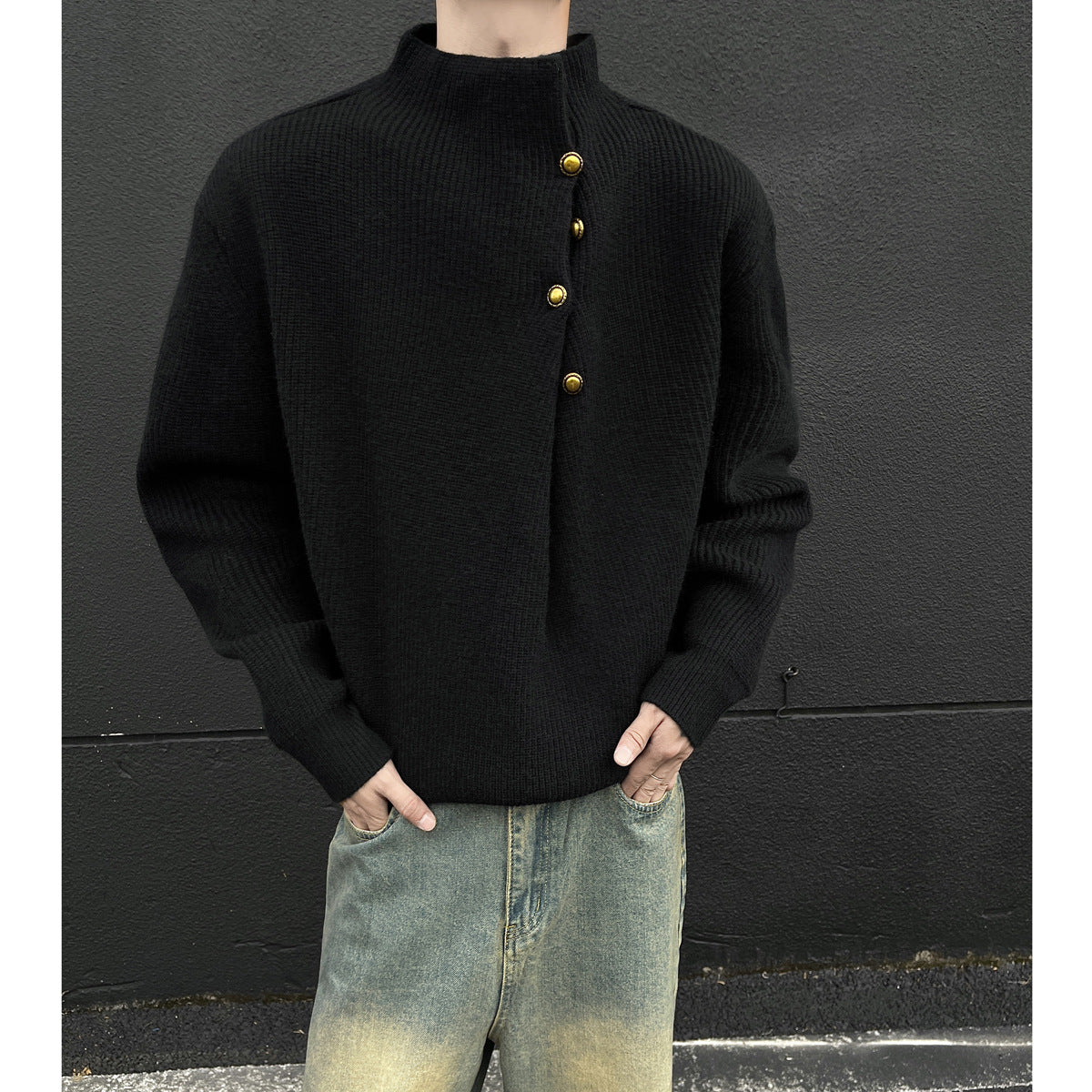 Irregularly buttoned high-neck sweater with a stylish and laid-back vibe, oversized knitted top