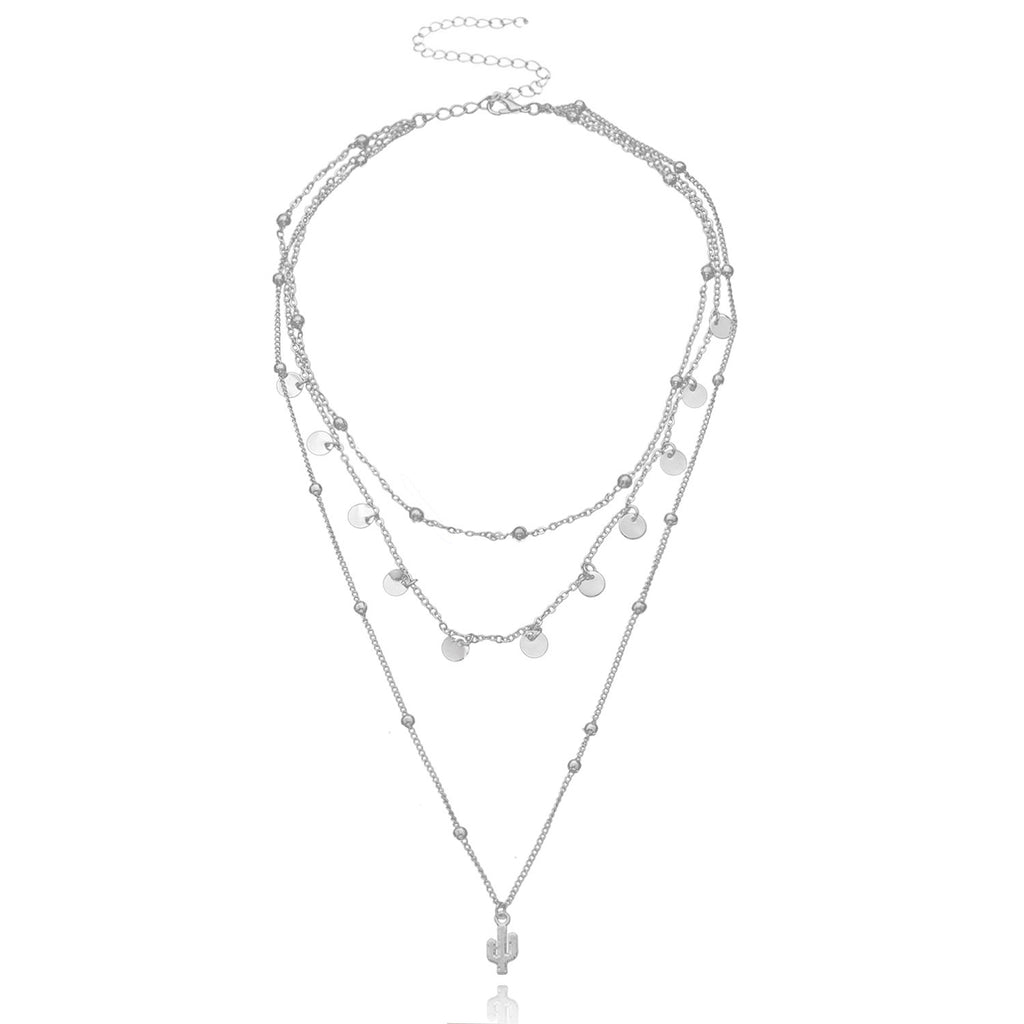 A multi-layered necklace featuring a round cactus pendant and a women's round bead chain