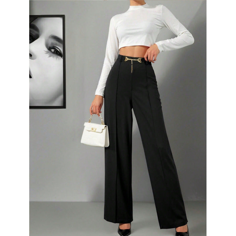 This is a pair of high-waisted straight-leg black high-end drape trousers for spring and autumn, paired with a belt